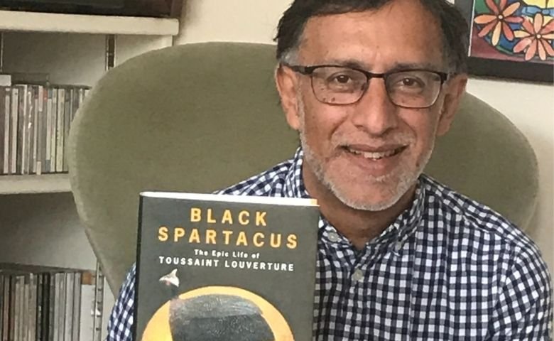 Author Sudhir Hazareesingh holding a copy of his book: Black Spartacus