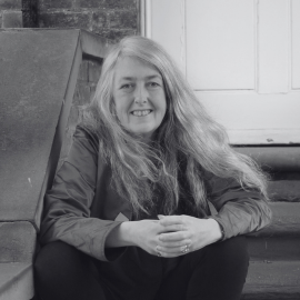 A black and white portrait photo of Carole Hillenbrand
